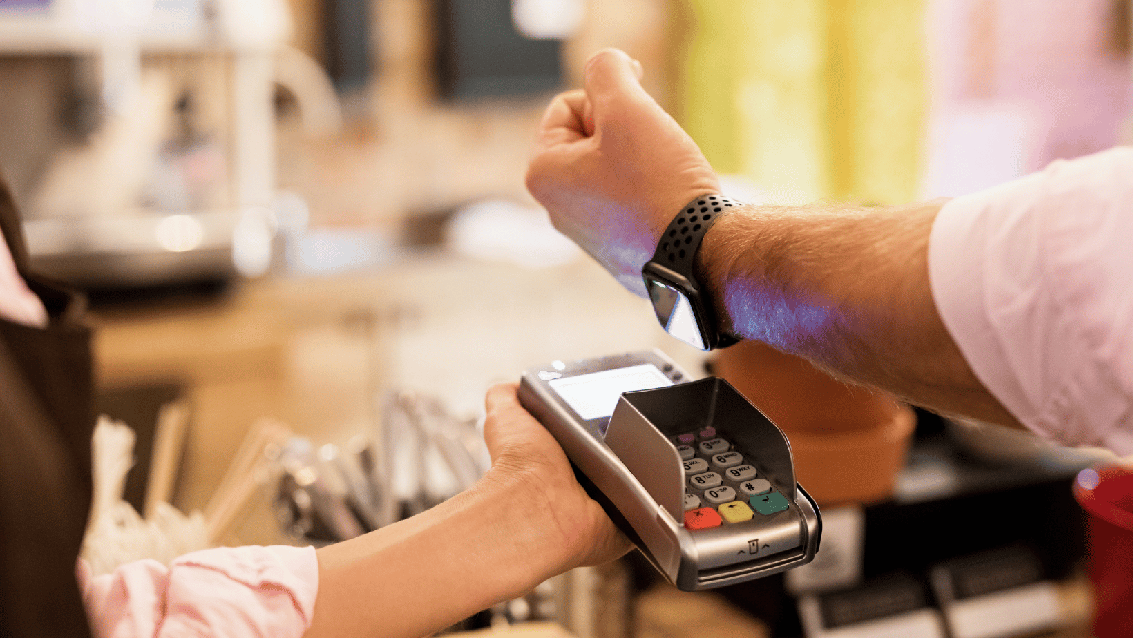 A man using his Apple Watch to pay