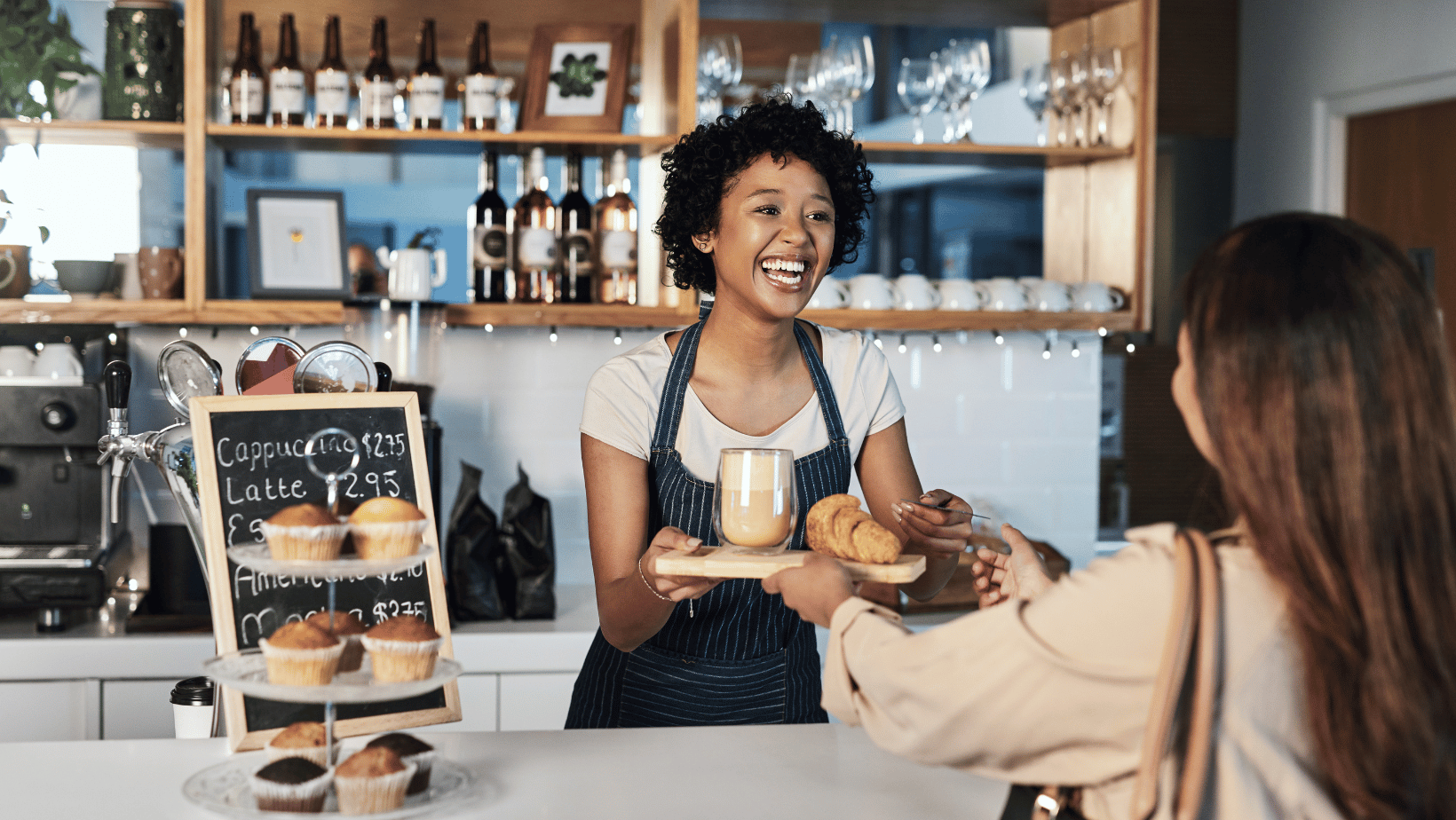 Smiling Barista Working in a Coffee Shop