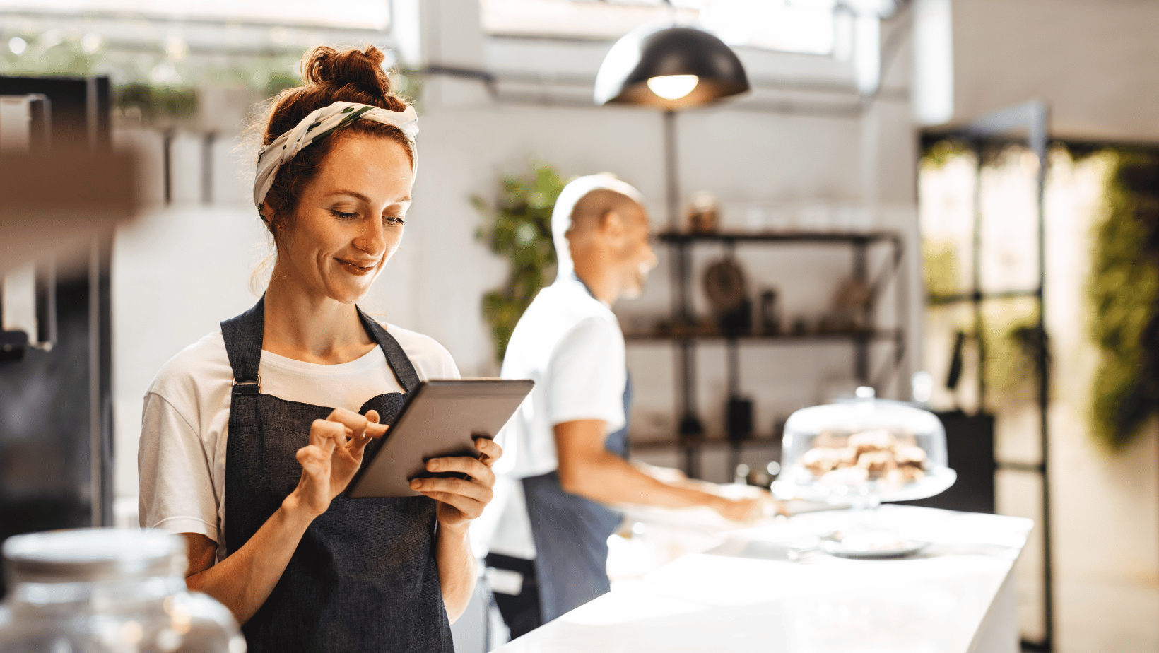 Barista using a tablet to manage mobile orders